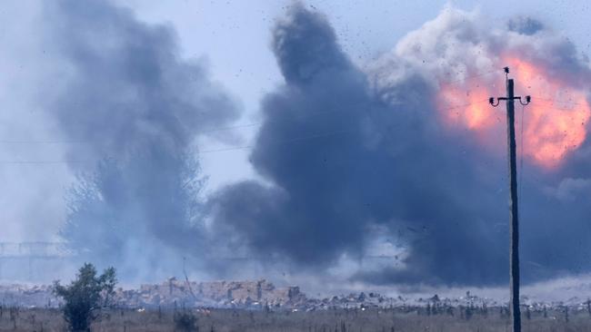 CRIMEA, RUSSIA  AUGUST 16, 2022: Smoke rises from a fire after an explosion at a temporary ammunition storage site of a military unit near the village of Mayskoye, Dzhankoi District. Sergei Malgavko/TASS/Sipa USA /AAP