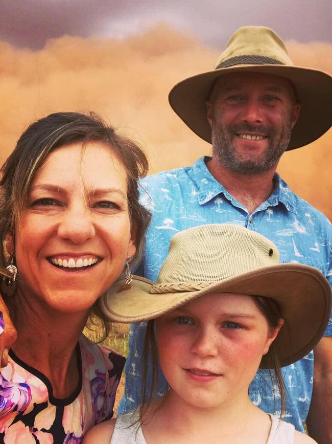 Katie McKid with her husband Rob Trepess and her daughter Summer couldn’t help but take a selfie with the “once-in-a-lifetime” storm. Picture: Supplied