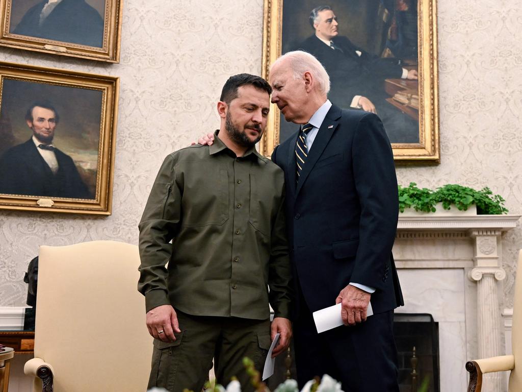 US President Joe Biden seeks to give Ukrainian President Volodymyr Zelenskyy a hand while he can. Picture: AFP