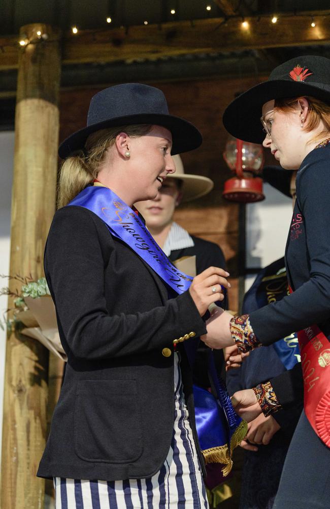 The 2025 Darling Downs Showgirl Taleyha Evans (left) of Stanthorpe accepts the sash from 2024 runner-up Showgirl Abby Brown at the announcement at the People First Bank Toowoomba Royal Show, Saturday, March 29, 2025. Picture: Kevin Farmer