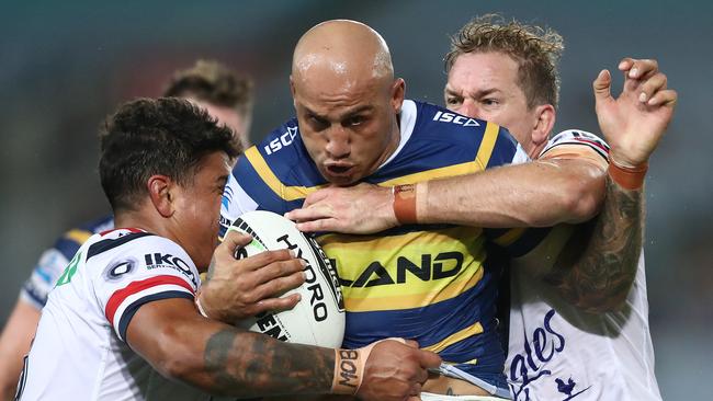 SYDNEY, AUSTRALIA - MARCH 29: Blake Ferguson of the Eels is tackled during the round three NRL match between the Parramatta Eels and the Sydney Roosters at ANZ Stadium on March 29, 2019 in Sydney, Australia. (Photo by Mark Metcalfe/Getty Images)