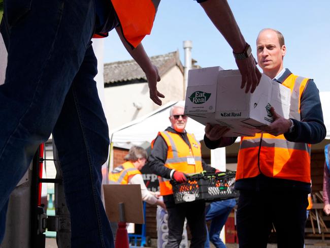 Prince William helped load trays of food into vans during a visit to Surplus to Supper, a surplus food redistribution charity. Picture: AFP