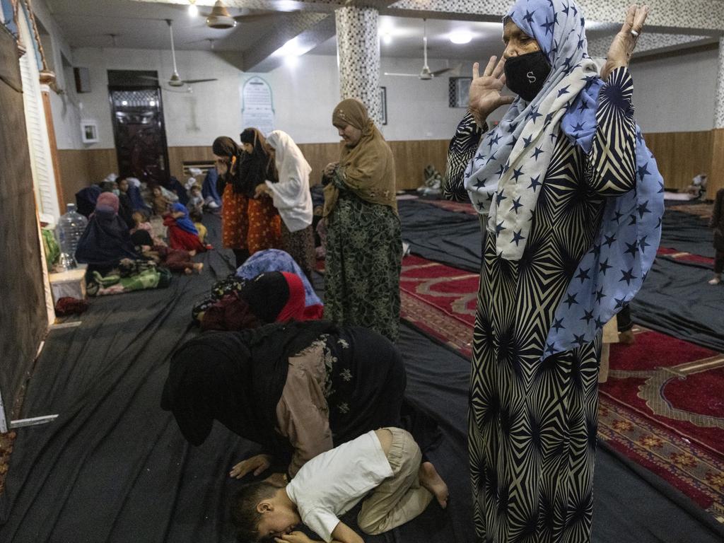 Displaced Afghan women and children from Kunduz pray at a mosque that is sheltering them n Kabul, Afghanistan. Picture: Paula Bronstein