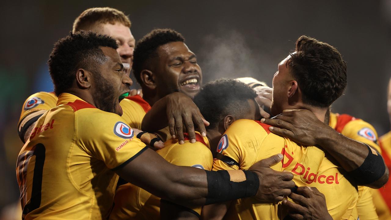 SYDNEY, AUSTRALIA - JUNE 25: Lachlan Lam of Papua New Guinea celebrates with teammates after scoring a try during the Men's International Test Match between Papua New Guinea and Fiji at Campbelltown Sports Stadium on June 25, 2022 in Sydney, Australia. (Photo by Mark Kolbe/Getty Images)