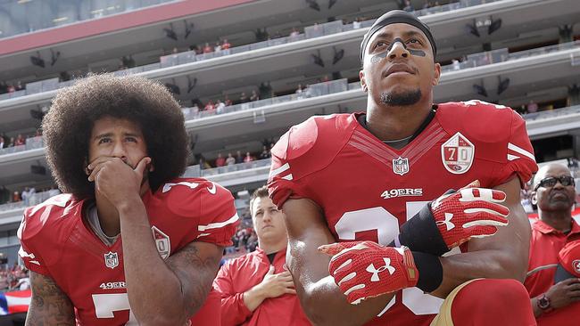 FILE - In this Oct. 2, 2016, file photo, San Francisco 49ers quarterback Colin Kaepernick, left, and safety Eric Reid kneel during the national anthem before an NFL football game against the Dallas Cowboys in Santa Clara, Calif. The Carolina Panthers have signed the free agent safety to a one-year contract. Terms of the deal were not announced Thursday, Sept. 27, 2018. (AP Photo/Marcio Jose Sanchez, File)