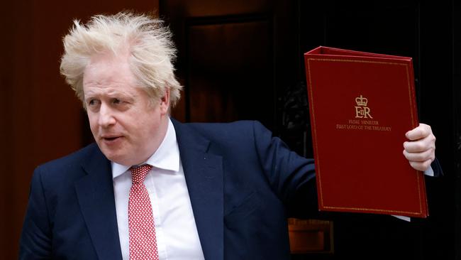 Boris Johnson leaves from 10 Downing Street to announce an end to all pandemic legal curbs in England. Picture: AFP.