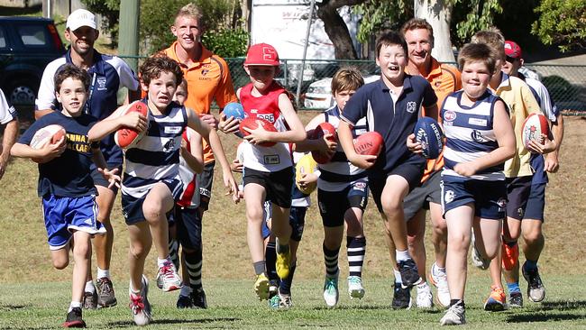 Craig Lambert and former Giant Sam Frost at a school clinic.