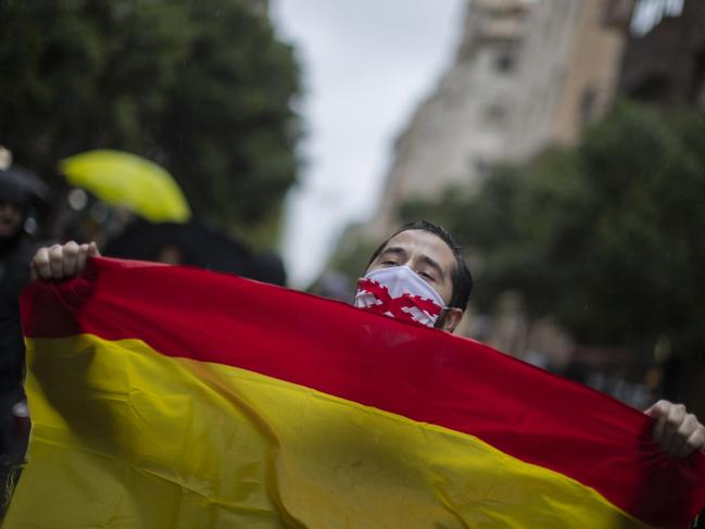 A man with a Spanish flag shouts slogans during a protest against the Spanish Government amid the lockdown to prevent the spread of coronavirus in Madrid, Spain. Picture: AP Photo/Manu Fernandez