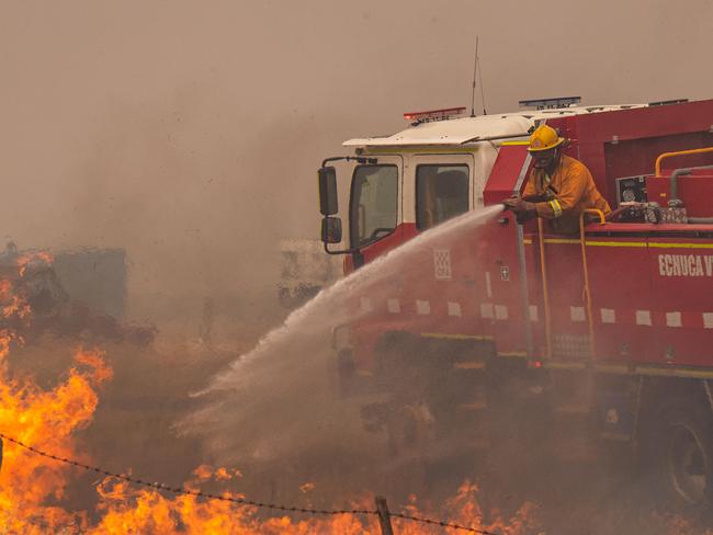 Echuca CFA tankers fight grass fires along Rochester-Strathallan road with the help of waterbombing air support helicopter     A fast moving grass fire impacts a farm, a railway line and destroys a shed and tractor just outside Rochester. Picture: Jason Edwards  Picture: Jason Edwards