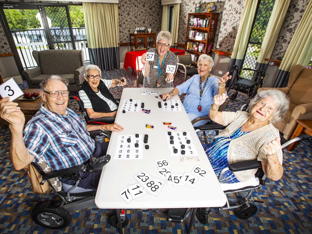 Volunteer Julie Filla sets up a game of Bingo with Tugun Bupa Aged Care residents Mac Jones, 88, Moira James, 97, Marie Gould, 87 and Marion Dorrough, 83. Picture: Nigel Hallett