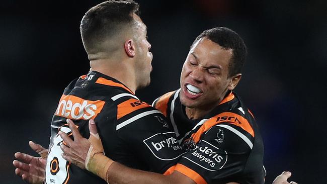 Tigers Luke Brooks celebrates with Tigers Moses Mbye.