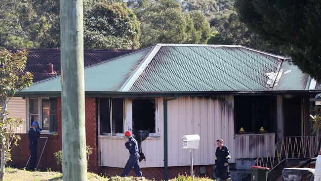 Fire investigators at the scene of the fatal house fire. Picture: David Swift