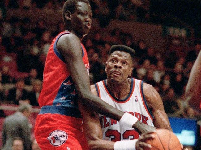 Patrick Ewing Jr’s dad, New York Knicks' Patrick Ewing (right) is blocked by Philadelphia 76ers' Manute Bol during an NBA basketball game at New York's Madison Square Garden. Picture: AP Photo/Jim Sulley.