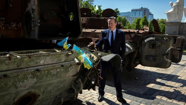 UK Foreign Secretary David Cameron walks past a display of destroyed Russian military vehicles in Kyiv last week. Picture: Getty Images