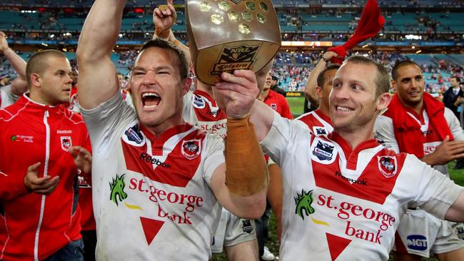 03/10/2010 NEWS: NRL- Grand Final Sydney Roosters v St.George Illawarra Dragons at ANZ Stadium. Dean Young and Ben Hornby leave the field with the NRL trophy .