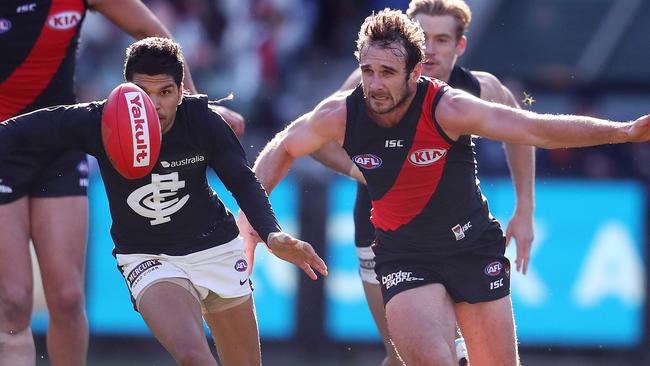 Jobe Watson chases Carlton’s Sam Petrevski-Seton. Picture: Michael Klein