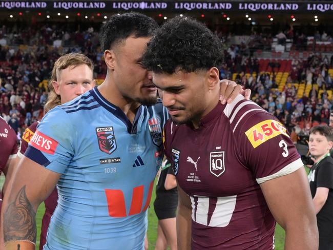 BRISBANE, AUSTRALIA - MAY 28: Robert Toia of the Maroons and Spencer Leniu of the Blues embrace at full time following game one of the Men's State of Origin series between Queensland Maroons and New South Wales Blues at Suncorp Stadium on May 28, 2025 in Brisbane, Australia. (Photo by Bradley Kanaris/Getty Images)
