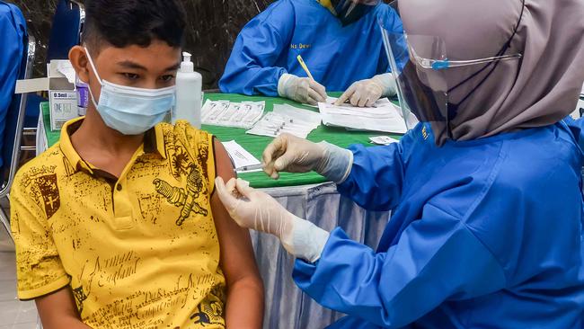 An Indonesian teenager receives the Sinovac Covid-19 coronavirus vaccine in Pekanbaru last week. Picture: AFP