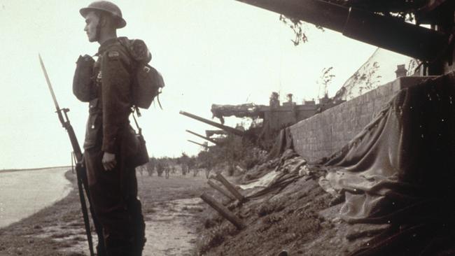 A soldier keeps watch as the flotilla approaches.