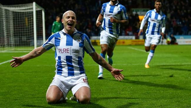 Aaron Mooy celebrates scoring for Huddersfield.