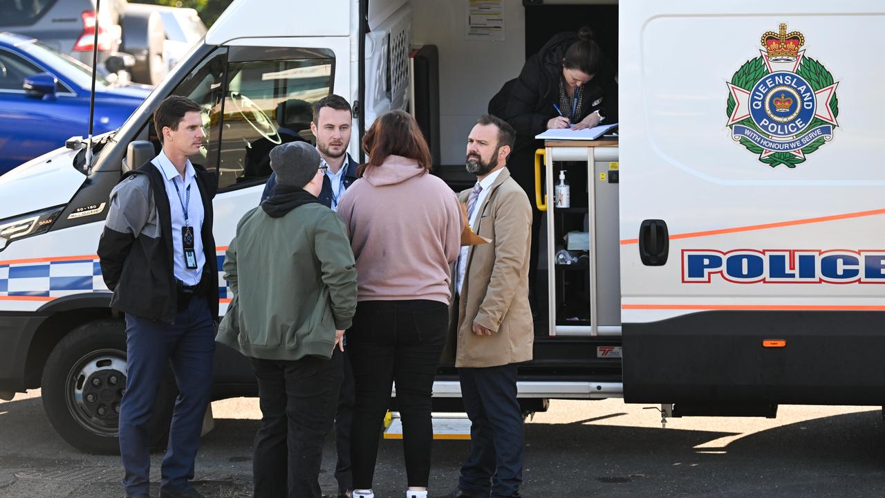 Police officers talk to a local residents outside a childcare centre where Kiesha Thompson, 23, had dropped her daughter on July 19th Picture: Dan Peled / NewsWire