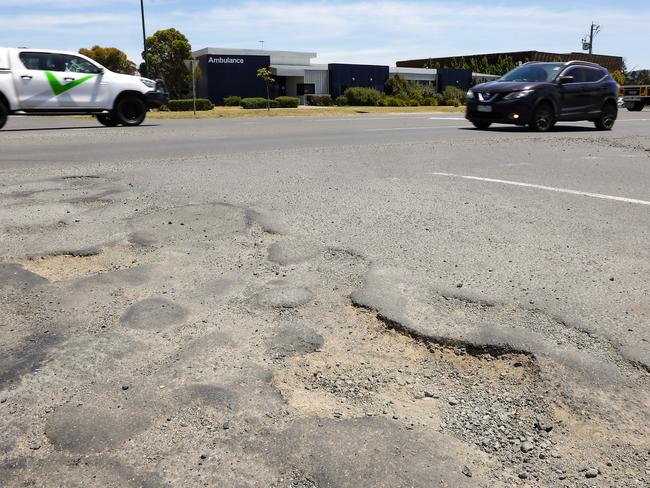 Potholes on the corner of Northern Highway and Duke Street in Wallan. Picture: Ian Currie