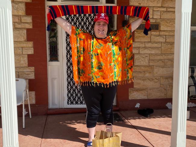 Adelaide United's head of commercial Adam Thompson and communications chief Marius Zanin, delivering packs to some of the club's longest serving members including Sonia Di Pardo. Picture: Adelaide United.