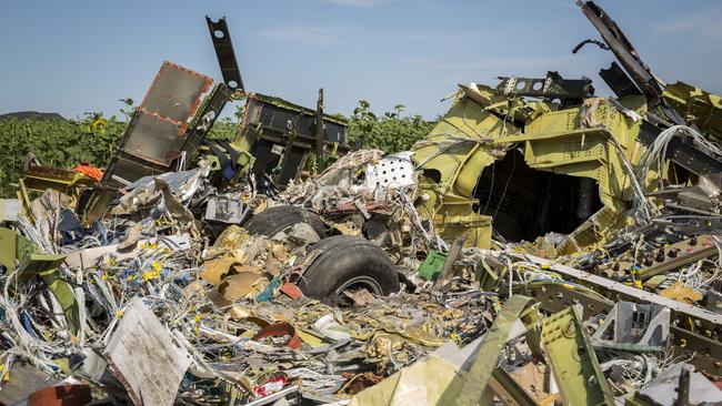 Malaysia Airlines flight MH17 lies in a field in Rassipnoye, Ukraine. Picture: Getty Images