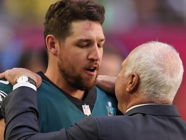 GLENDALE, ARIZONA - FEBRUARY 12: Arryn Siposs #8 and Philadelphia Eagles owner Jeffrey Lurie embrace before Super Bowl LVII between the Kansas City Chiefs and the Philadelphia Eagles at State Farm Stadium on February 12, 2023 in Glendale, Arizona. (Photo by Gregory Shamus/Getty Images)