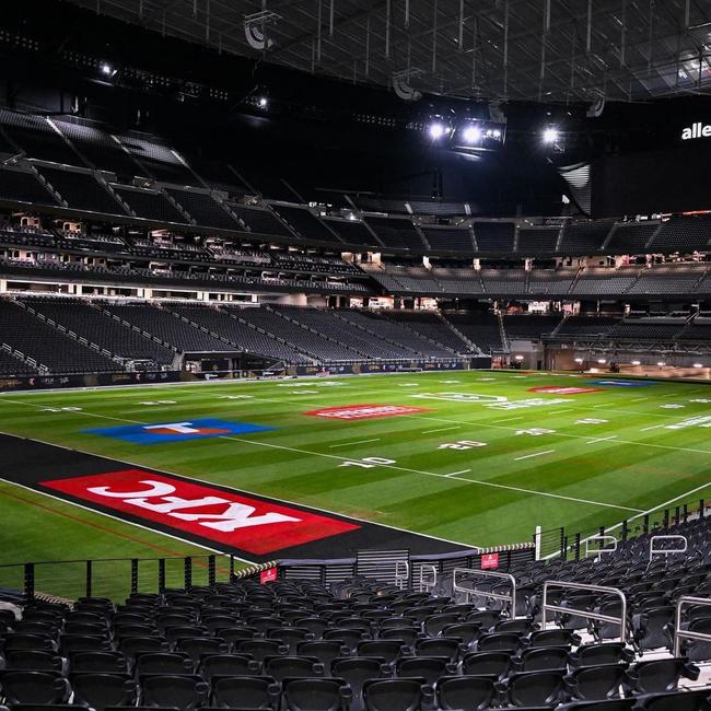 View from the stands with the signage and advertising on the grass.