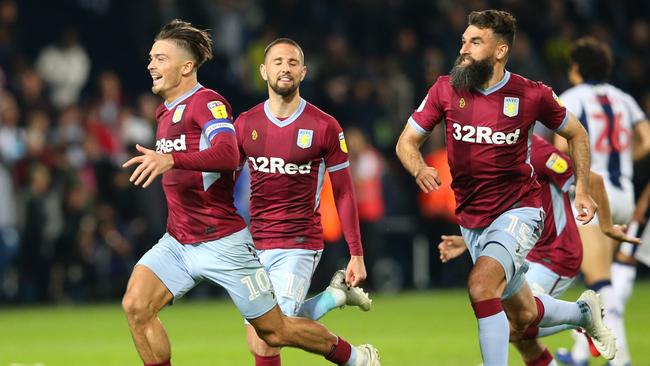 Mile Jedinak celebrates a goal with Aston Villa teammates Jack Grealish and Conor Hourihane. Picture: Getty