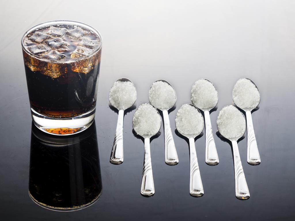 Concept of fizzy cola drinks with unhealthy sugar content.