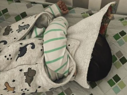 Mum finds 5mo son sleeping with bib covering his face. Picture: Supplied/Kidspot