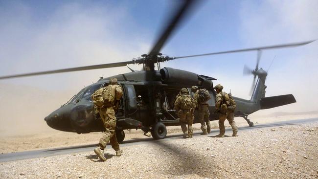 Soldiers from Australians Special Operations Task Group board a US Army Black Hawk helicopter after a mission in Uruzgan province, southern Afghanistan.