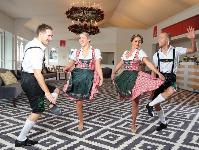 Mixing business with leader ... Nick Phillips, Britt Battams, Tayla Lemon and Reid Monks with the German Slap Dancers at the Emirates Marquee. Picture: Alex Coppel