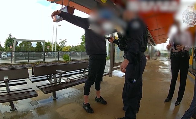 A man is wanded by Taskforce Guardian officers at a Gold Coast tram station. Picture: Queensland Police Service.