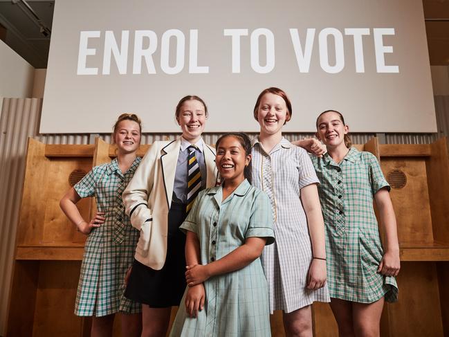 Bridget, 16 from Henley High School, Lara, 16 from Pulteney Grammar, Chantelle-Jordan-Bernardo, 16 from Thomas Mote College, Lily, 16 from Adelaide High School and Kiana, 16 from Henley High School pose for a picture at the polling booths at the Centre for Democracy in Adelaide, Friday, Feb. 23, 2018. (AAP Image/MATT LOXTON)