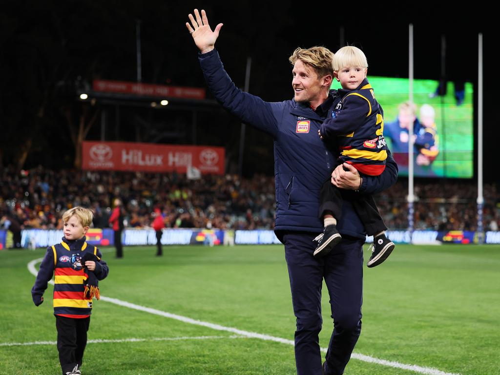 Sloane with sons Sonny and Bodhi during his lap of honour. Picture:James Elsby/AFL Photos