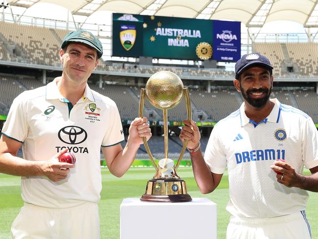 Australia captain Pat Cummins and Indian counterpart Jasprit Bumrah pose with the Border-Gavaskar Trophy. Picture: Getty Images