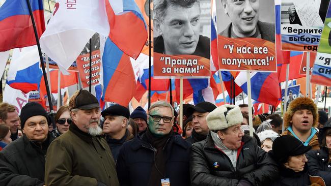 Then Russian opposition leader Mikhail Kasyanov (C) and supporters of slain Russian opposition leader Boris Nemtsov during a memorial march in 2017. Picture: AFP.