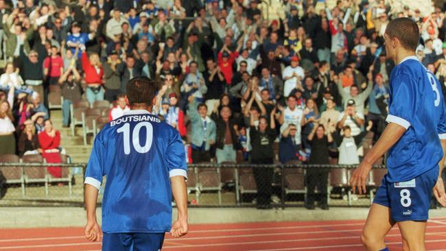 South's Con Boutsianis celebrates a goal with the crowd and Vaughan Coveny. South Melbourne v Sydney Olympic, 2001. PHOTO: George Salpigtidis.