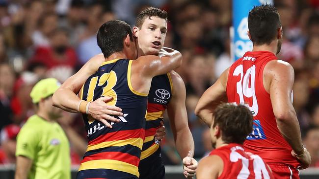 Josh Jenkins hugs Taylor Walker after a goal against the Swans. Picture: Getty Images