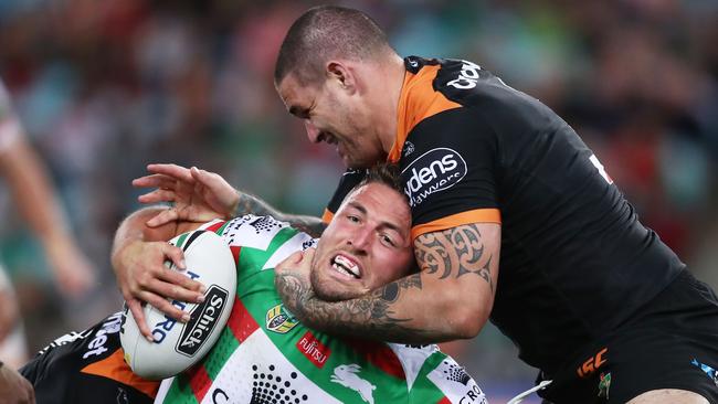 SYDNEY, AUSTRALIA - JULY 21:  Sam Burgess of the Rabbitohs is tackled during the round 19 NRL match between the Wests Tigers and the South Sydney Rabbitohs at ANZ Stadium on July 21, 2018 in Sydney, Australia.  (Photo by Matt King/Getty Images)