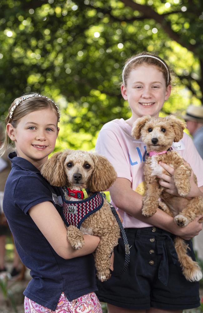 Sisters Penelope (left) holding Murphy and Annie Morgan holding Molly at the Blessing of the Pets at All Saints Anglican Church, Saturday, October 12, 2024. Picture: Kevin Farmer