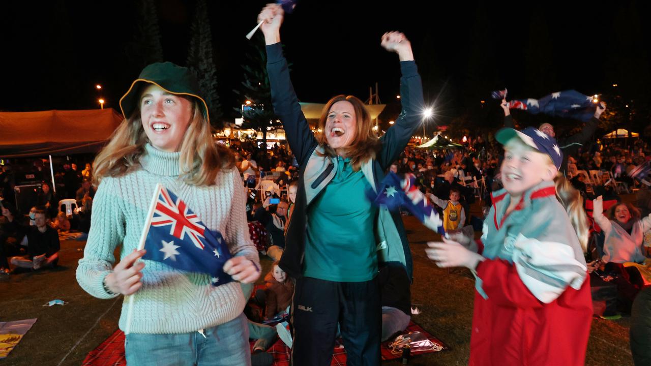 Charlene Stewart celebrates with daughters Mia 12, and Sian 10, at Kings Beach in Caloundra as Brisbane is announced as the host of the 2032 Olympic Games. Picture: Lachie Millard