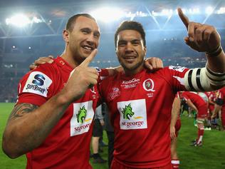 BRISBANE, AUSTRALIA - JULY 09: Quade Cooper of the Reds celebrates with team mate Digby Ioane after winning the 2011 Super Rugby Grand Final match with team mates between the Reds and the Crusaders at Suncorp Stadium on July 9, 2011 in Brisbane, Australia. (Photo by Cameron Spencer/Getty Images)