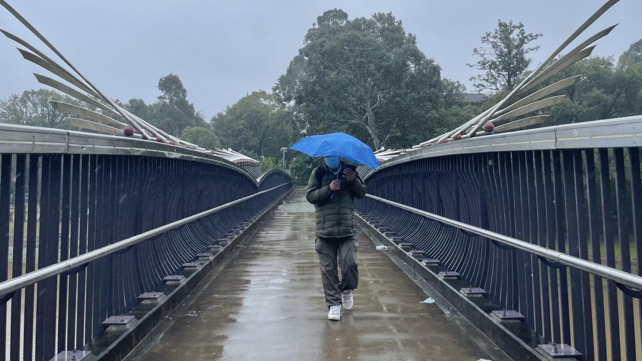 A man crosses the Parramatta River approaching Phillip St.