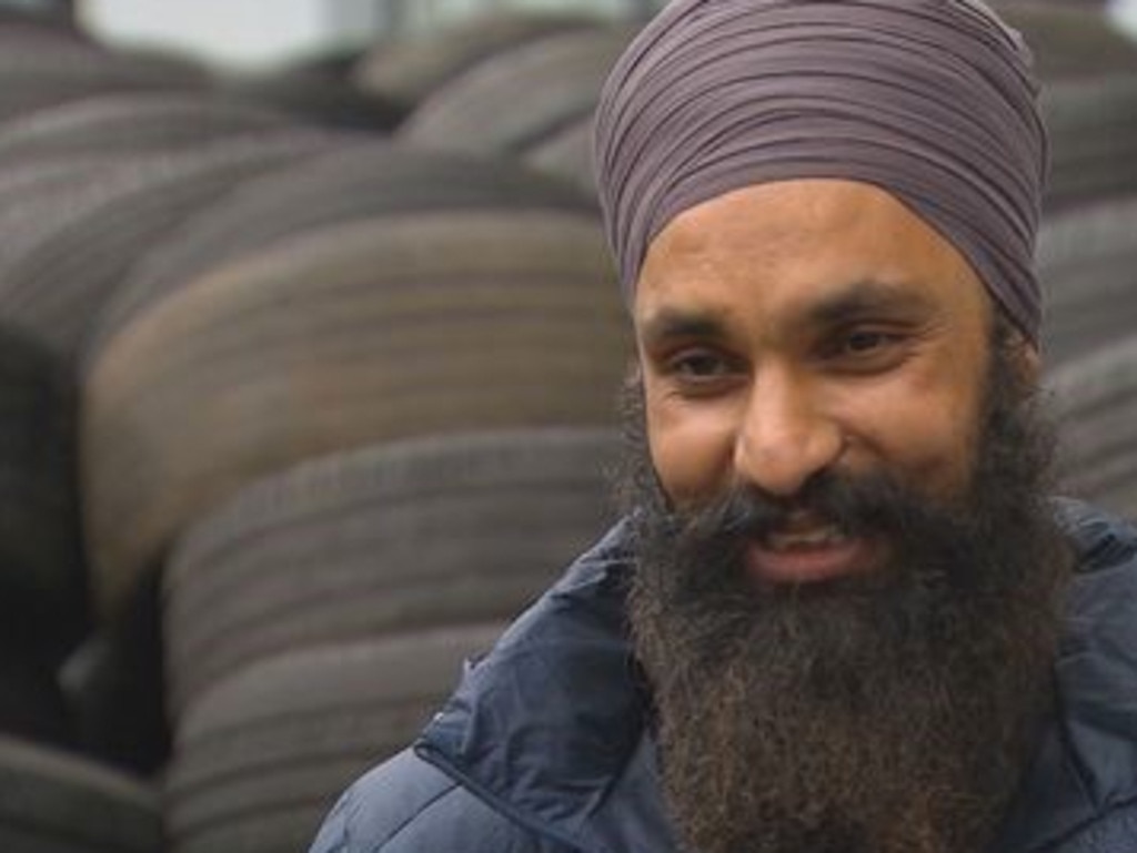 A Blacktown family arrived home to find their driveway stacked with hundreds of used tyres, leaving them and their neighbours puzzled about how such a mix-up could occur. Picture: 9 News