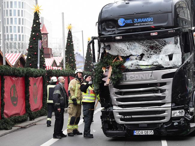 Firemen inspecting the truck that crashed into a Christmas market at Gedächtniskirche church in Berlin in December. Picture: AFP