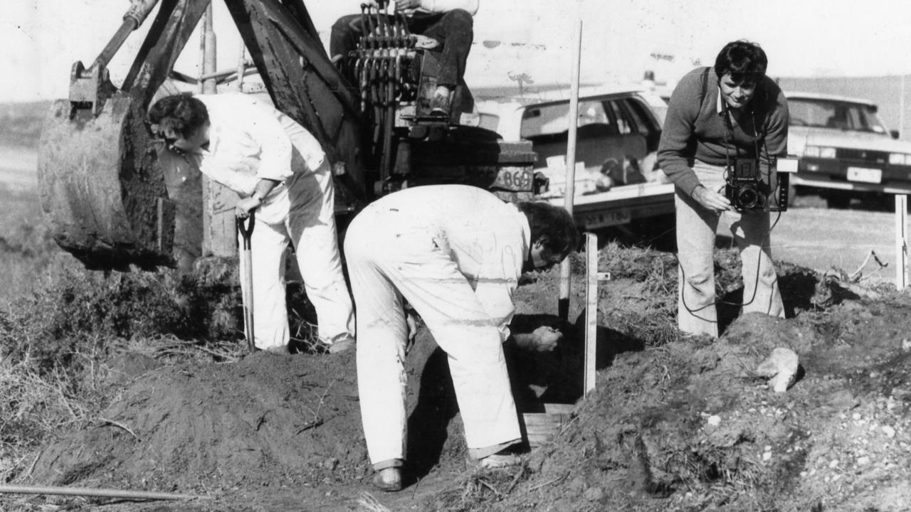 Police search with earthmoving equipment after finding the skeletal remains of 14-year-old Peter Stogneff.